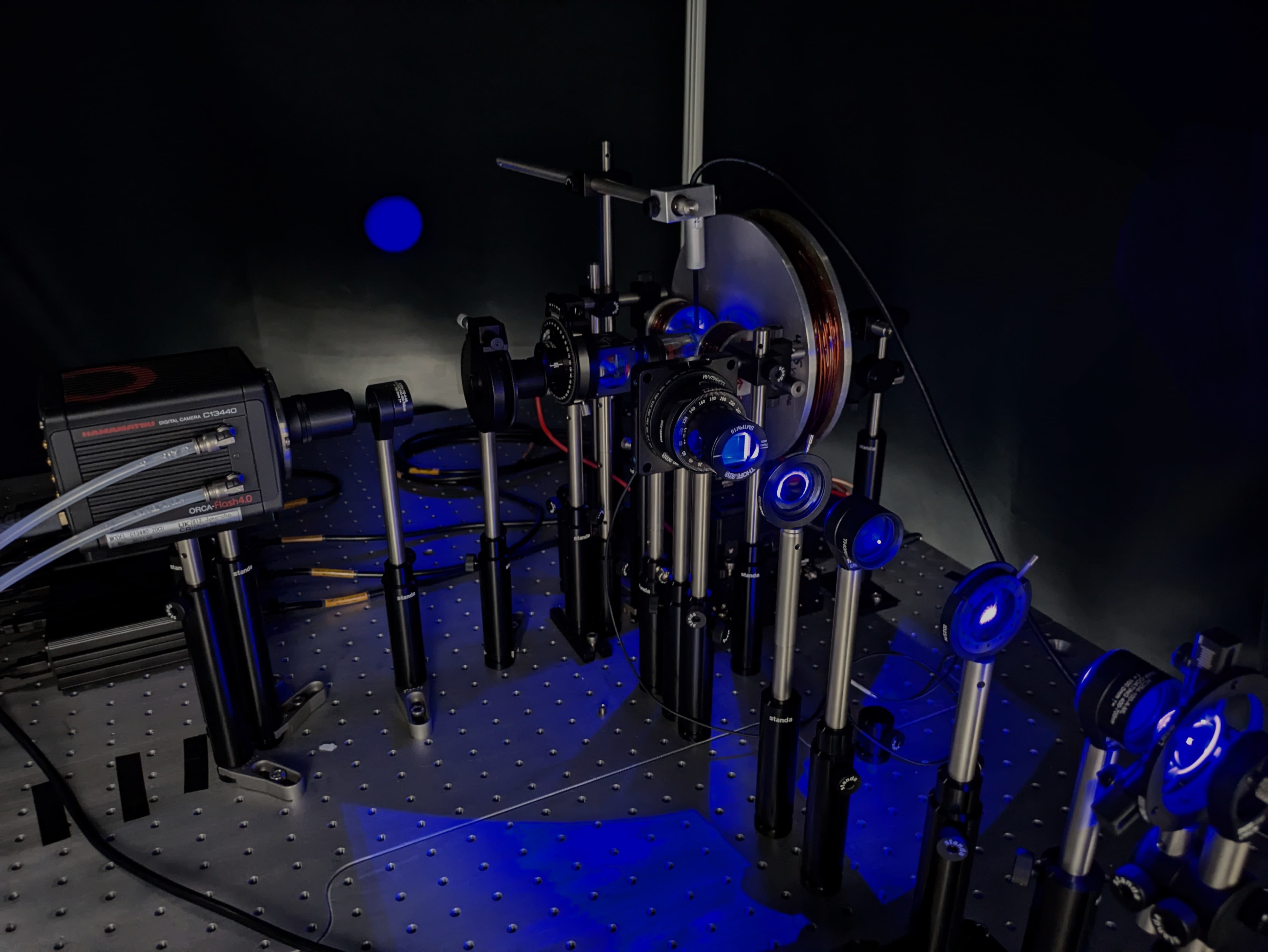 Wide-field magneto-optical Kerr effect (MOKE) setup able to operate in polar and longitudinal modes for out-of-plane and in-plane magnetic contrast imaging of thin magnetic layers. Equipped with RGB diode illumination, 20x and 50x focus objectives, a 3D motorized position stage, and a CMOS camera. Offers spatial resolution ~300 nm and field view ~200µm. Magnetic fields up to ~2kOe out-of-plane and ~1kOe in-plane can be applied, with the ability to apply current pulses during imaging experiments.